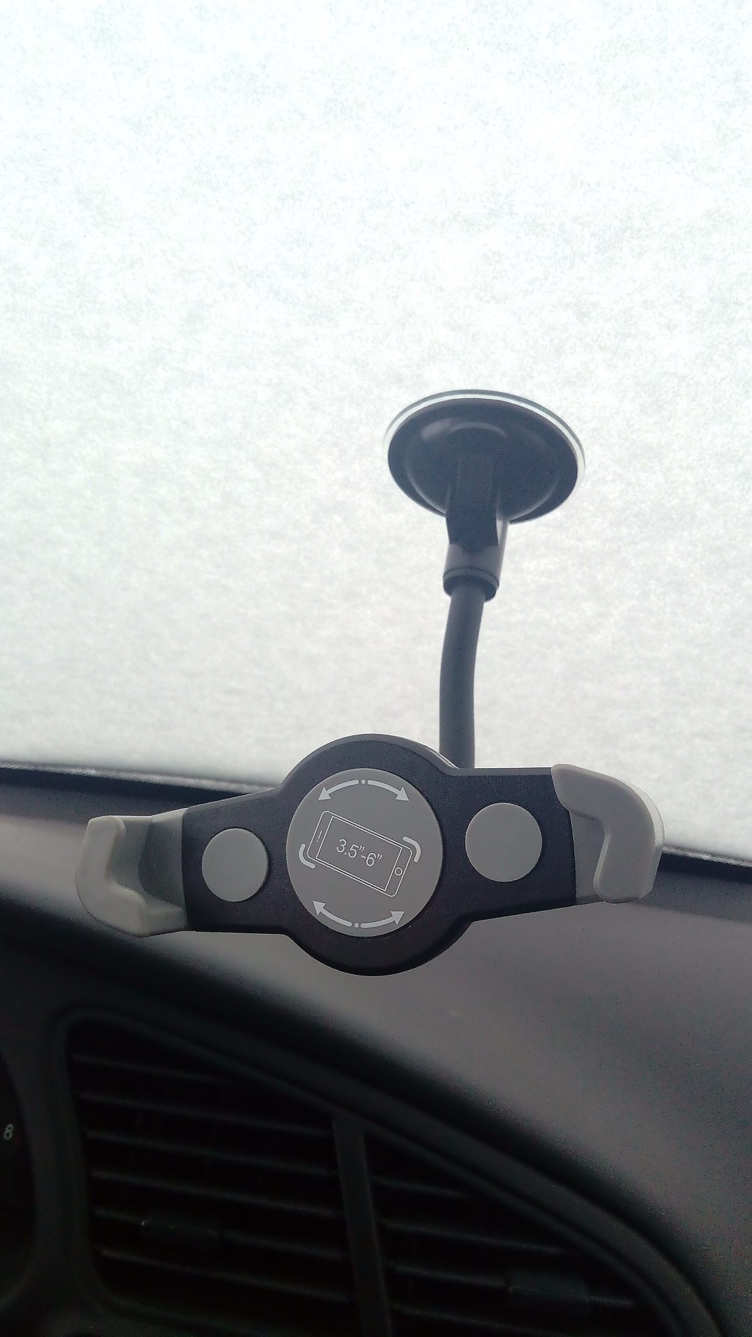 Suction-mount phone holder on a windscreen