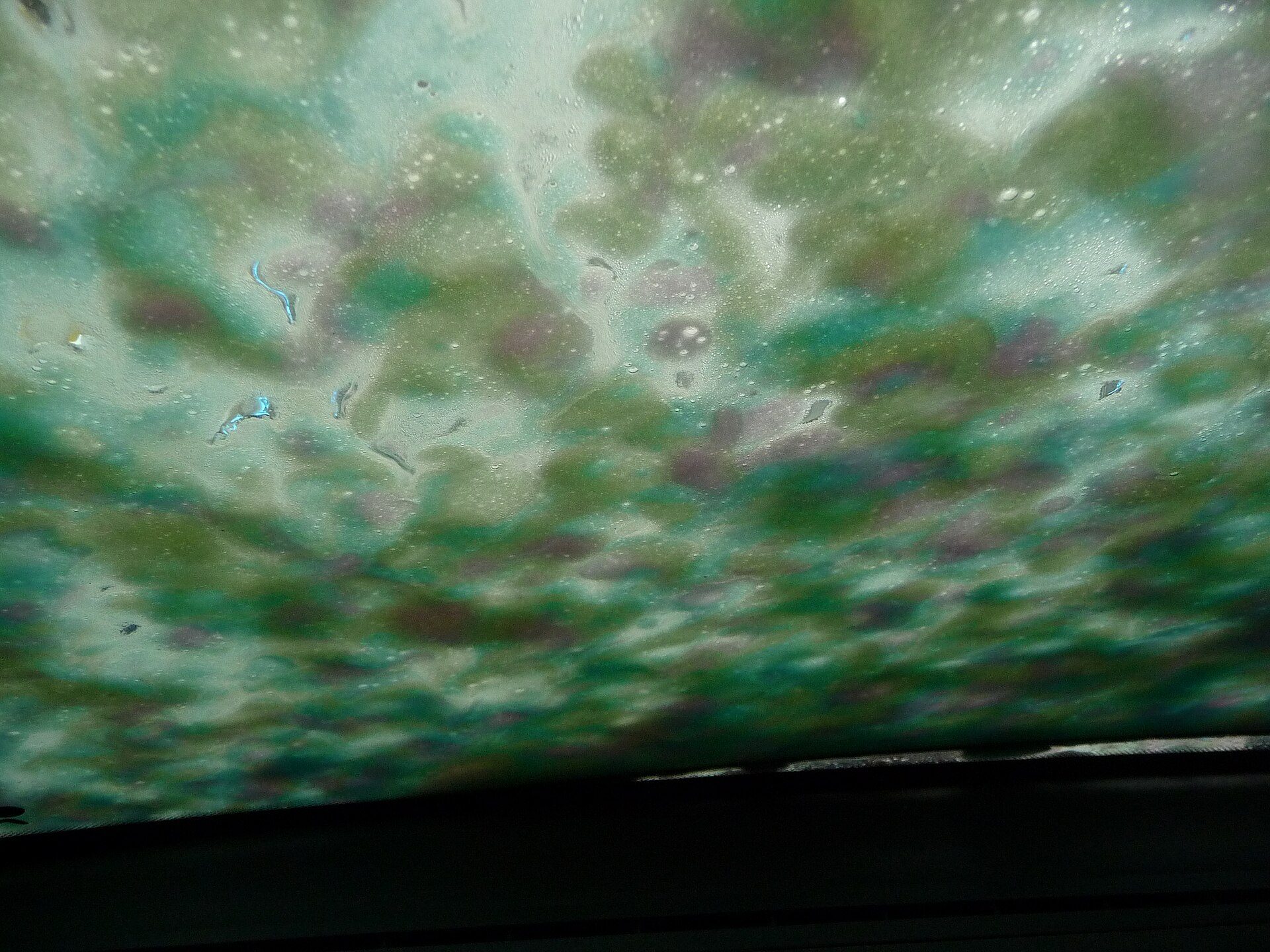 Active foam running down a car during a wash